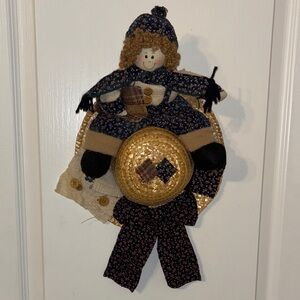 decorative doll or country doll," farmhouse-style door or wall decoration.